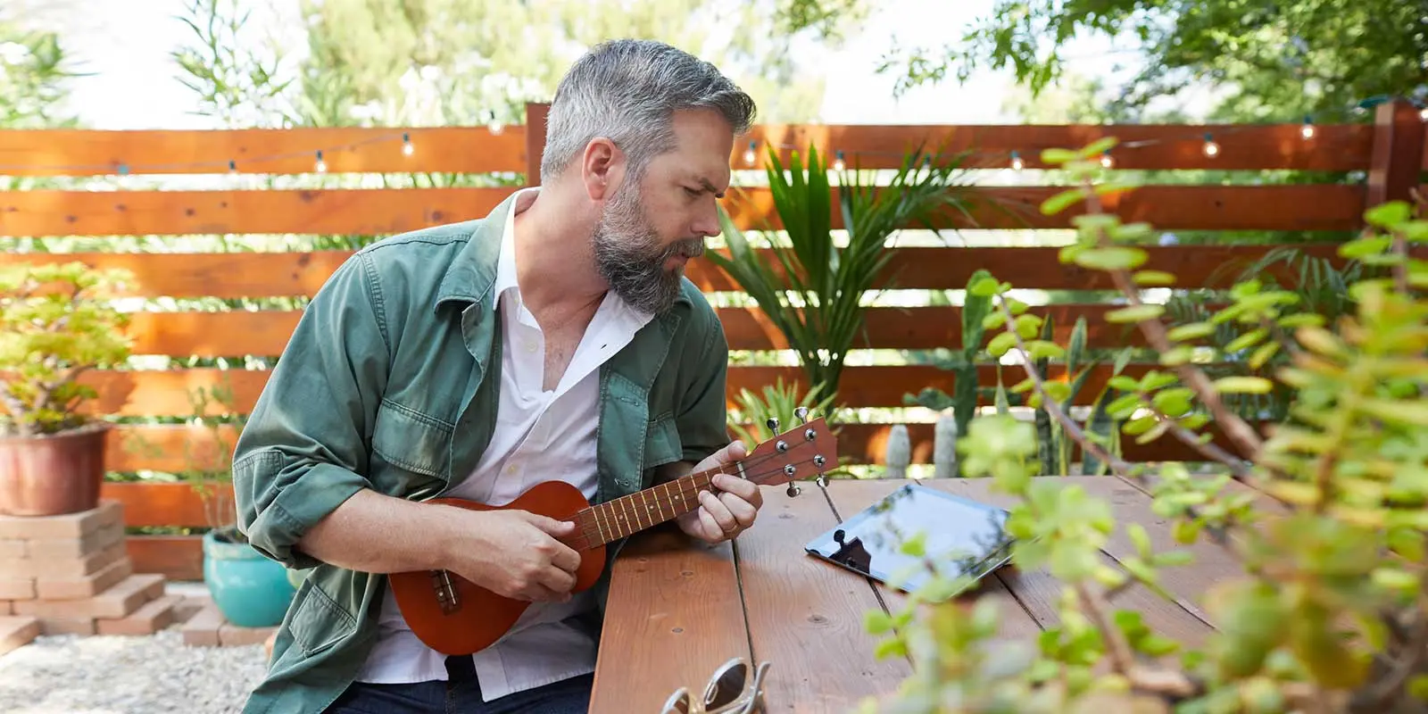 A person playing a ukulele