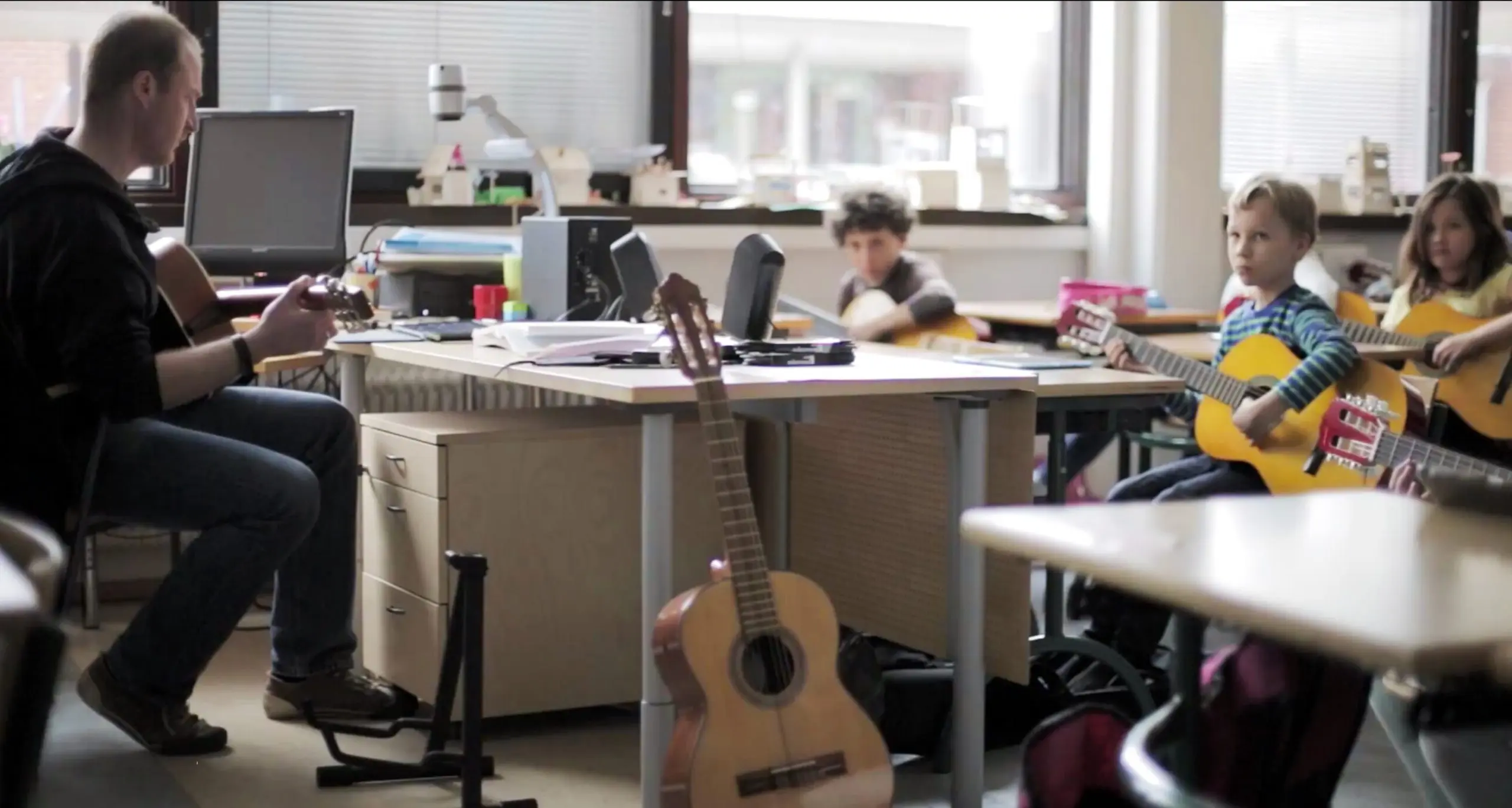 Children playing music with Yousician
